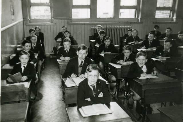 Down memory lane: Rastrick Grammar School pupils pictured in a class in 1953. Rastrick Grammar at Ogden Lane merged with Reinswood Secondary School, to form Rastrick High in 1985.
