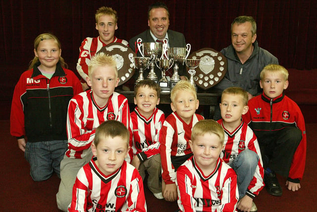Crossleys football teams and club officials at Illingworth Sports and Social Club in 2007. Back, from the left, are Sam Crowther, club secretary Mick Gavan and club chairman Paul Dungworth. Front, from the left, are Bethany Armstrong, ten, Scott Tomkins, 12, Rourke Woolley, six, Max Halsworth, seven, Regan Armstrong, seven, Matthew Gavan, seven, Mason Butterfield and Daniel Spencer, 12