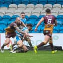 James Woodburn-Hall goes over for Halifax's second try against Batley Bulldogs last Sunday. Photo by Simon Hall.