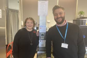Christine Gow from Harveys with James Slavin from Yorkshire Payments unveiling the new contactless card reader which customers can use to donate