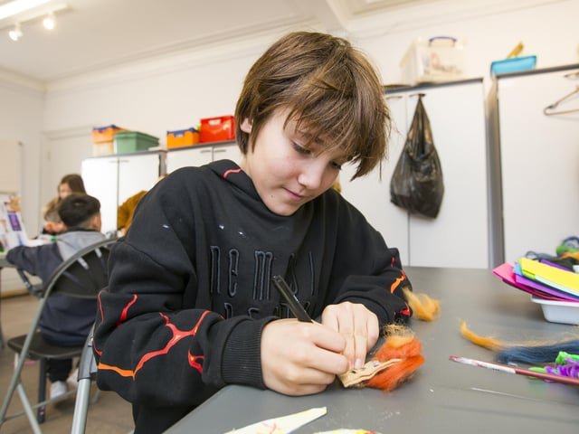Bankfield Museum exhibition opening - A Magical Couple of Hours - A Celebration of Pantomime. Ned, 11, takes part in the craft activities.