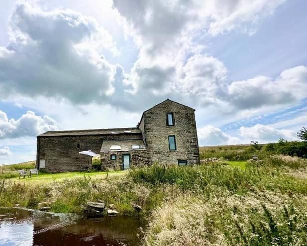 View of the farmhouse in its stunning rural and moorland setting.