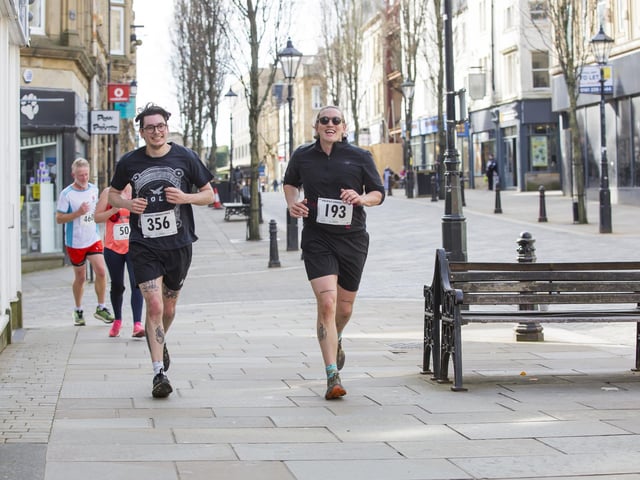 Halifax Urban Trail run through the town's iconic landmarks for Overgate Hospice. Corn Market