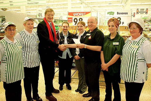 Asda, Halifax present a donation to the Changing Faces charity.