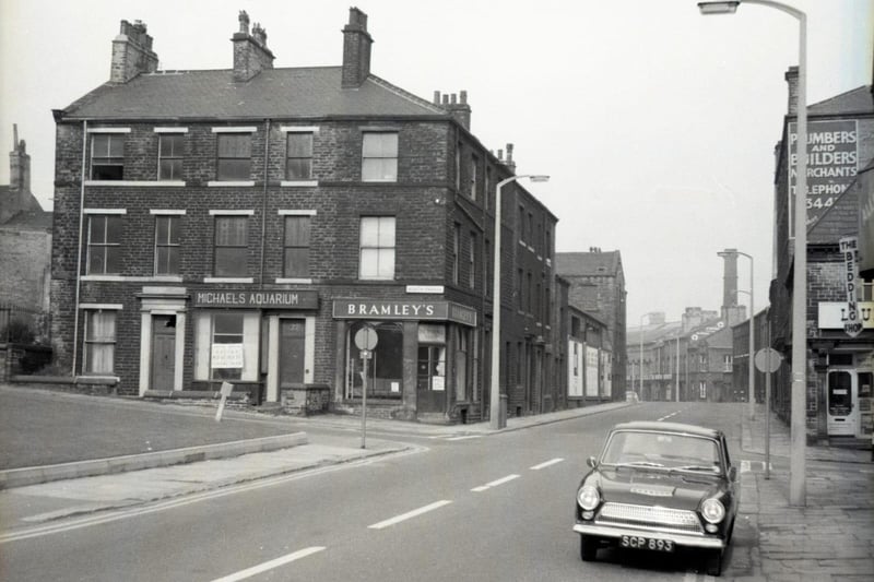 Orange Street, leading to Corporation Street in the distance, with the chimney of Whitakers Brewery