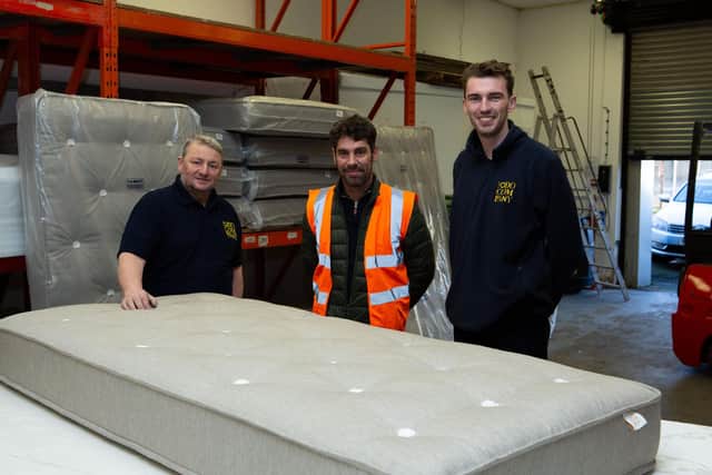 The Odd Company have developed a mattress especially for charity  Zarach which they will start distributing to families over the Christmas period. Pictured are Richard Elsey and Andrew Seed from the Odd Co and Russell Davis - in centre - from Zarach