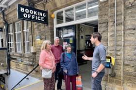 Councillor Scott Patient speaking to rail users at Hebden Bridge Train Station