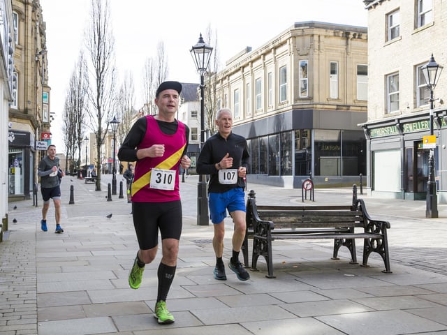 Halifax Urban Trail run through the town's iconic landmarks for Overgate Hospice. Corn Market
