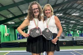 Tracey Povey, right, and Isabel Kay, left, celebrate their Welsh title.