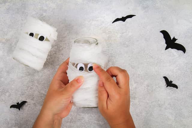 Make a mummy or two using glass jars and bandaging.