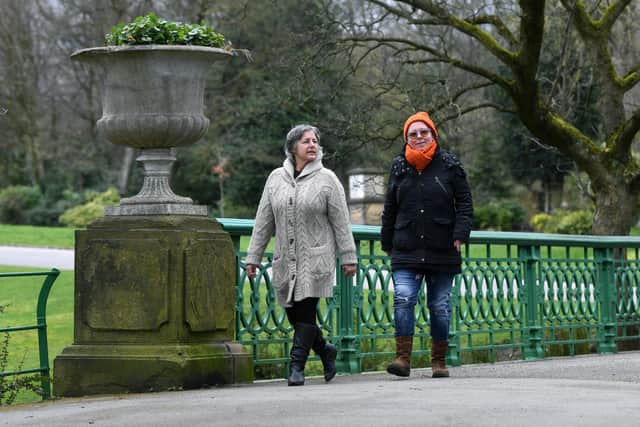 Olena Bezlepkina, right, walks in People's Park, Halifax,  with Mandy Cioch. Neighbouring King's Church has become a facility used by lots of Ukranians who have settled in Calderdale. Picture: Jonathan Gawthorpe.