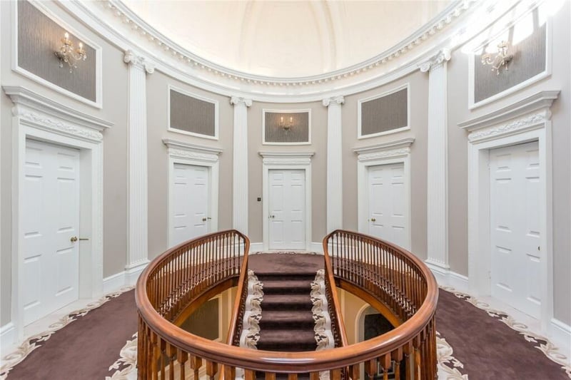 The oval first floor landing, at the top of the 'flying staircase'.