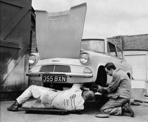 A Ford Anglia undergoing an MOT (Ministry of Transport) test.   (Photo by Fred Mott/Getty Images)