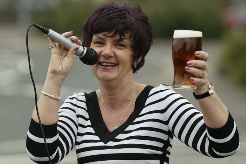 Landlady of The Barge, Brighouse Michelle Hadala raises a glass to the success of the Pub Idol competition back in 2004.