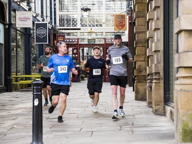 Halifax Urban Trail run through the town's iconic landmarks for Overgate Hospice. Calderdale Borough Market