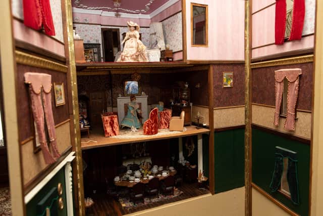 The house is home to several delicately crafted dolls.