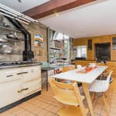 The bright and spacious kitchen has a white Aga cooker and a built in gas oven. With the extensive fitted units are granite worktops.