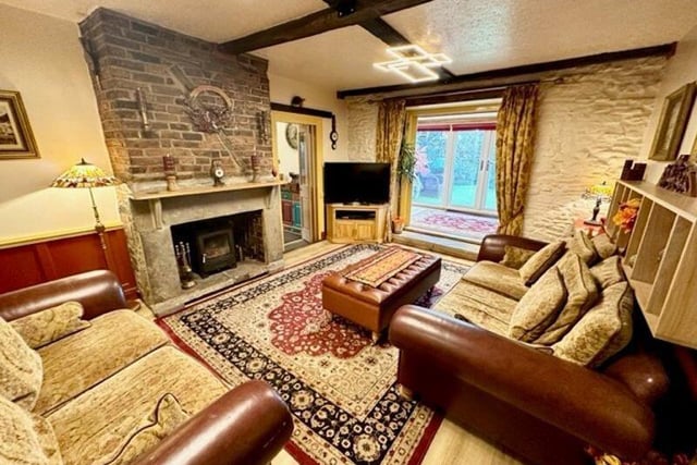 The lounge has a feature inglenook fireplace and a multi fuel stove.