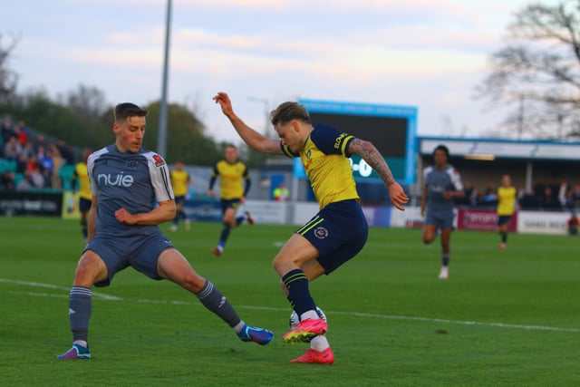 Tylor Golden tries to stop Solihull's Jack Stevens