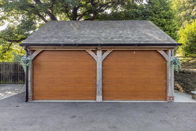 The Paragon Oak double garage with electric Hormann doors, automatic lighting, power and water.
