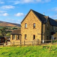 This four bedroom semi-detached property with countryside and reservoir views is for sale