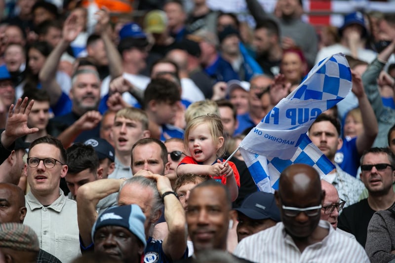 Town fans celebrate victory at Wembley.