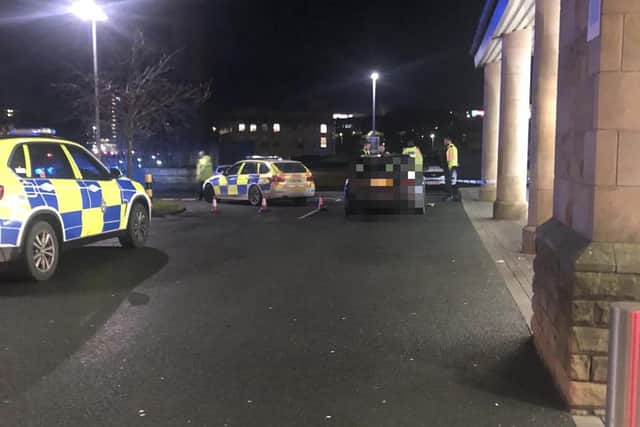 Police outside Lidl in Boothtown this evening