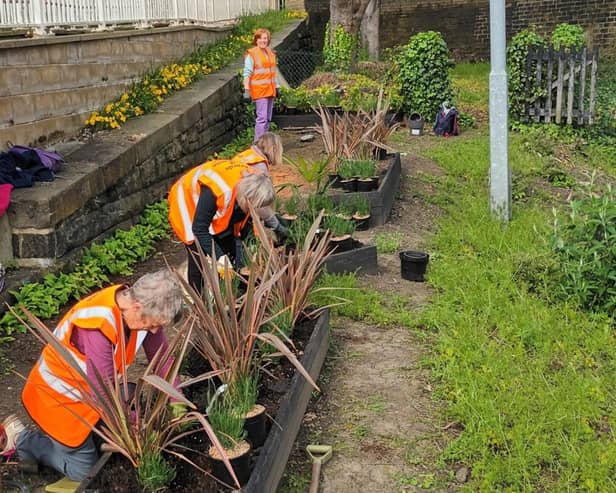 Volunteers working on Brighouse station Climate Change Garden