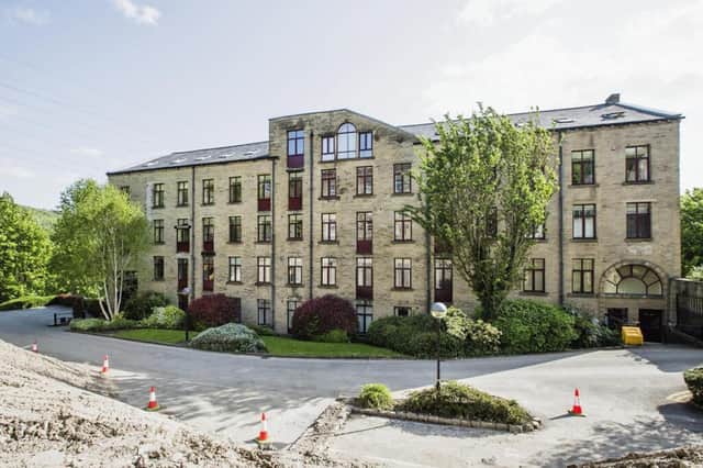 This two bedroom duplex apartment located in a mill conversion close to Halifax town centre is on the market for £100,000 with Reeds Rains.