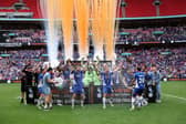 LONDON, ENGLAND - JUNE 01: Charlie Raglan and Tom Conlon of Oldham Athletic lift the trophy following victory in the Vanarama National League Promotion Play-off Final between Oldham Athletic and Southend United at Wembley Stadium on June 01, 2025 in London, England. (Photo by Richard Pelham/Getty Images)