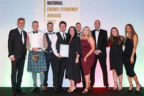 YES Energy Solutions being presented with Project Management Company of the Year at the National Energy Efficiency Awards by comedian Hugh Dennis.
Photograph by Jason Mitchell.