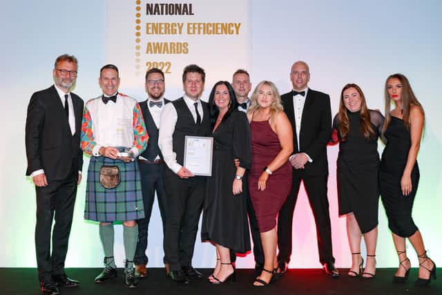 YES Energy Solutions being presented with Project Management Company of the Year at the National Energy Efficiency Awards by comedian Hugh Dennis.
Photograph by Jason Mitchell.