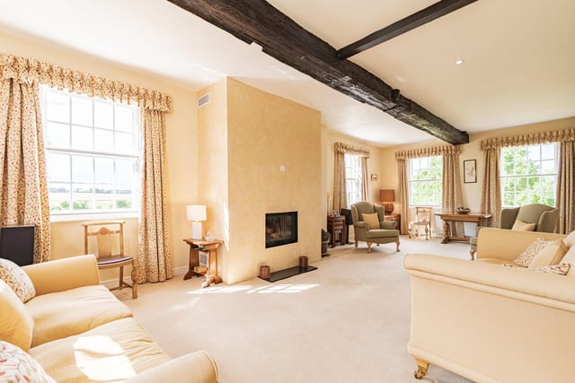 An extremely spacious drawing room of 30 feet, with natural light flooding in from three windows, has a recessed Italian firebox as a special feature.