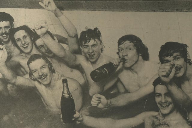 Town players celebrate their win in the bath