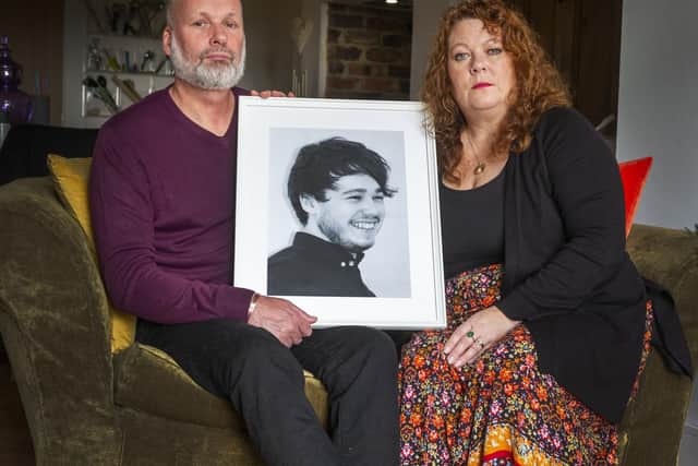 Andrew and Joanne Doody with a portrait of their son Peter.