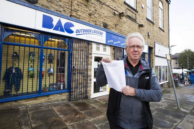 Dave Jackson at BAC Outdoor Leisure, Elland, with a petition launched by traders who want to save Coronation Street Car Park.