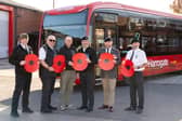 Transdev colleagues who are former Armed Forces personnel with poppies in front of a bus, operated by Transdev, for the Poppy Appeal 2026 campaign renewal.