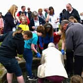 Time capsule being lowered into the well at Sandal Castle