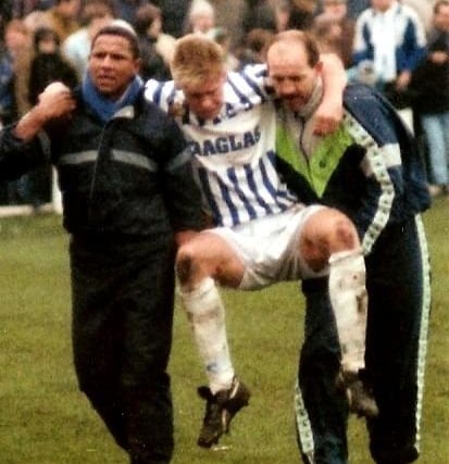 Russell Bradley is carried off against Marine in the FA Cup, November 14, 1992