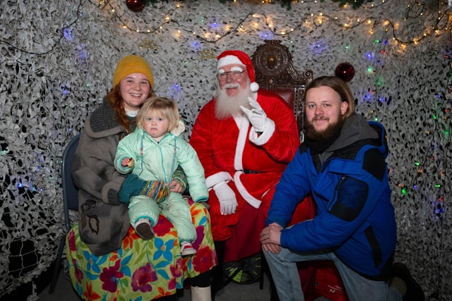 Natasha Guest, Adam Wells and little Norah Snow Wells meet Santa at the Mayor's Christmas fair at Halifax Town Hall