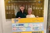 Past Lady Captain Janet and Pam Middleton with the cheque for the Hospice