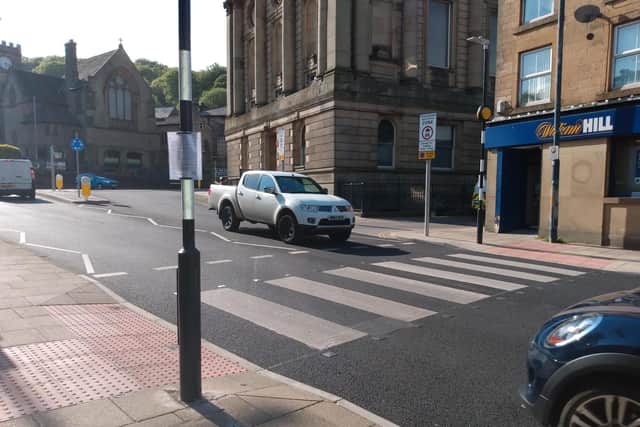 A consultation notice at the new zebra crossing at Halifax Road in Todmorden town centre