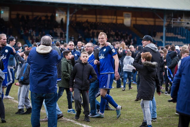 Jordan Burrow is congratulated by Town fans
