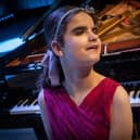 Last year Channel 4 broadcast the first series of The Piano. Halifax's Lucy, who is blind and neurodiverse, wowed crowds in Leeds during the series and even went on to win the show. Picture: Love Productions/Mark Bourdillon