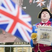 Halifax town crier Les Cutts bellows the proclamation of King Charles III’s Coronation at the Piece Hall