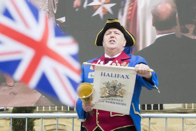 Halifax town crier Les Cutts bellows the proclamation of King Charles III’s Coronation at the Piece Hall
