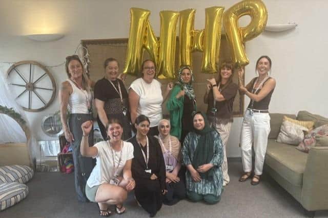 Jubilee Nursery staff celebrate their positive Ofsted report, which has been published following an inspection in June. The nursery is part of the North Halifax Partnership.