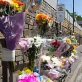 Flowers at the scene of a fatal accident on Burnley Road, Friendly