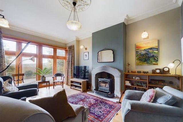 The spacious lounge features a large, mullion bay window to the front elevation and a second window to the side providing the room with natural light throughout.