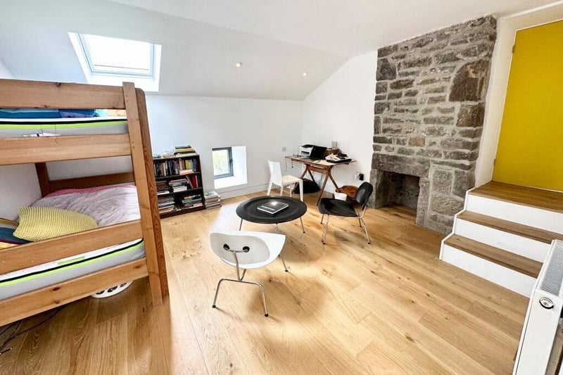 Exposed stone and velux windows in the flexible space presented by many of the rooms.